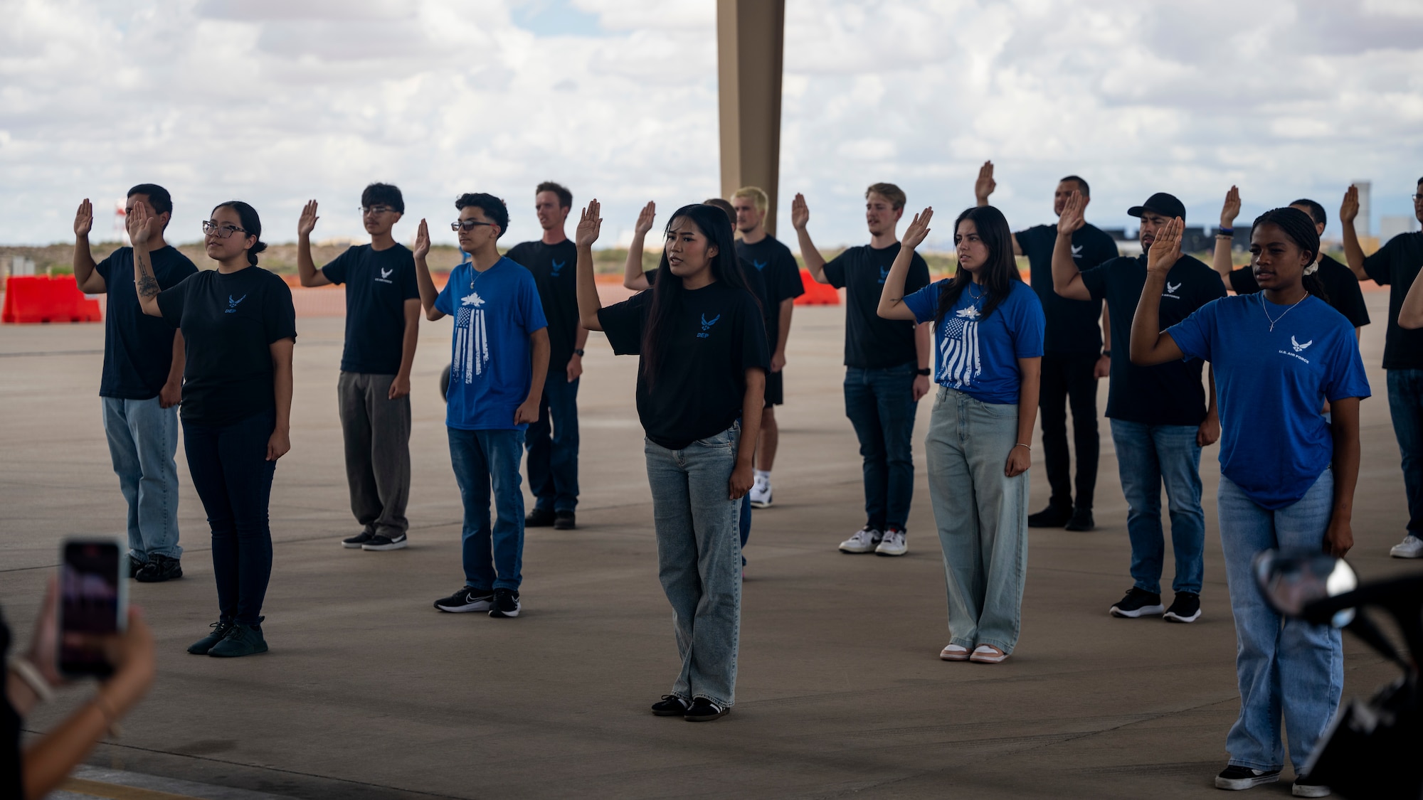 Local Air Force recruits take the oath of enlistment during Community Connections Day at Holloman Air Force Base, New Mexico, Sept. 6, 2025. Twenty-one recruits took the oath of enlistment in front of friends, family and community members during the open house festivities of Community Connections Day. (U.S. Air Force photo by Tech. Sgt. Victor J. Caputo)