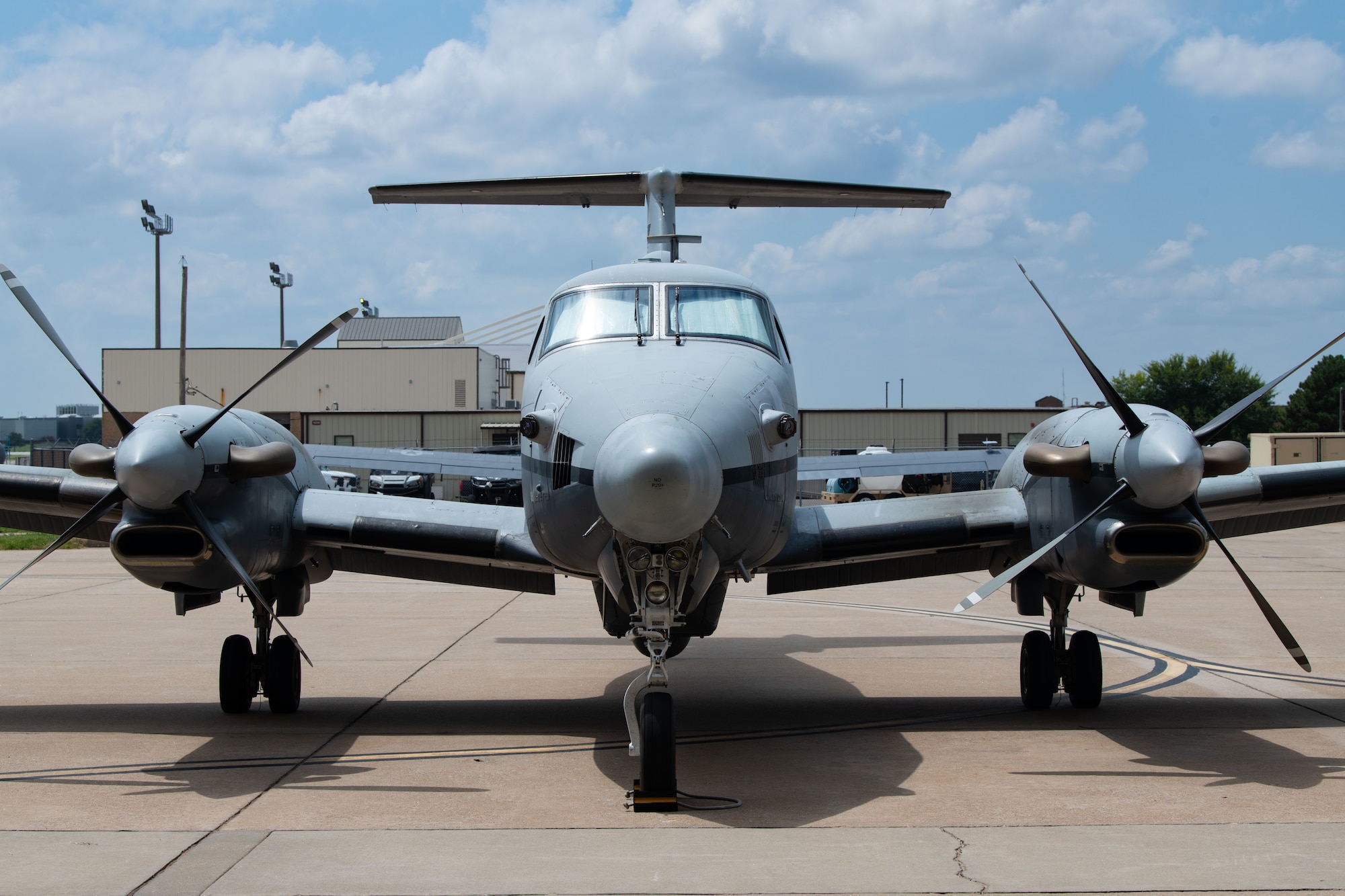 an aircraft sits on a flightline