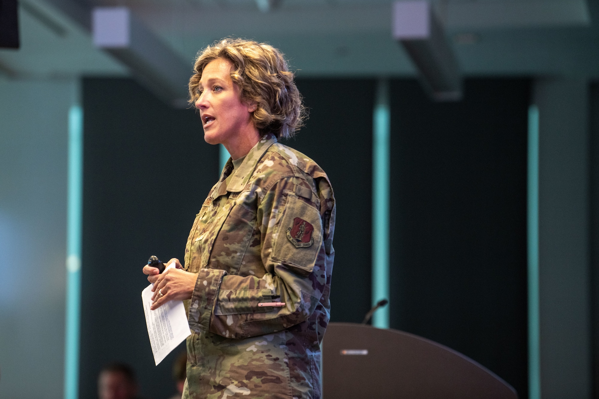 An uniformed woman presents