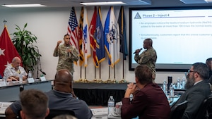 Maryland Army National Guard Col. Louis Patrick Hawkins Jr., Maryland National Guard chief of the joint staff, and Maryland Air National Guard Lt. Col. Michael S. Graham Jr., J6 for cyber operations with the Maryland National Guard Joint Staff, lead Maryland National Guardsmen and civilian security and infrastructure cybersecurity experts in a tabletop exercise during the third day of the State of Maryland Critical Infrastructure Cyber Resilience Workshop at the Technology Advancement Center in Columbia, Maryland, August 28, 2025. The Maryland Critical Infrastructure Cyber Resilience Workshop, which focused on the water and wastewater sector during the three-day event, was co-organized by the Office of the Under Secretary of Defense for Acquisition and Sustainment Cyber Warfare Directorate, the Maryland National Guard, and the state of Maryland. (U.S. Air National Guard Photo by Airman 1st Class Sarah Hoover)