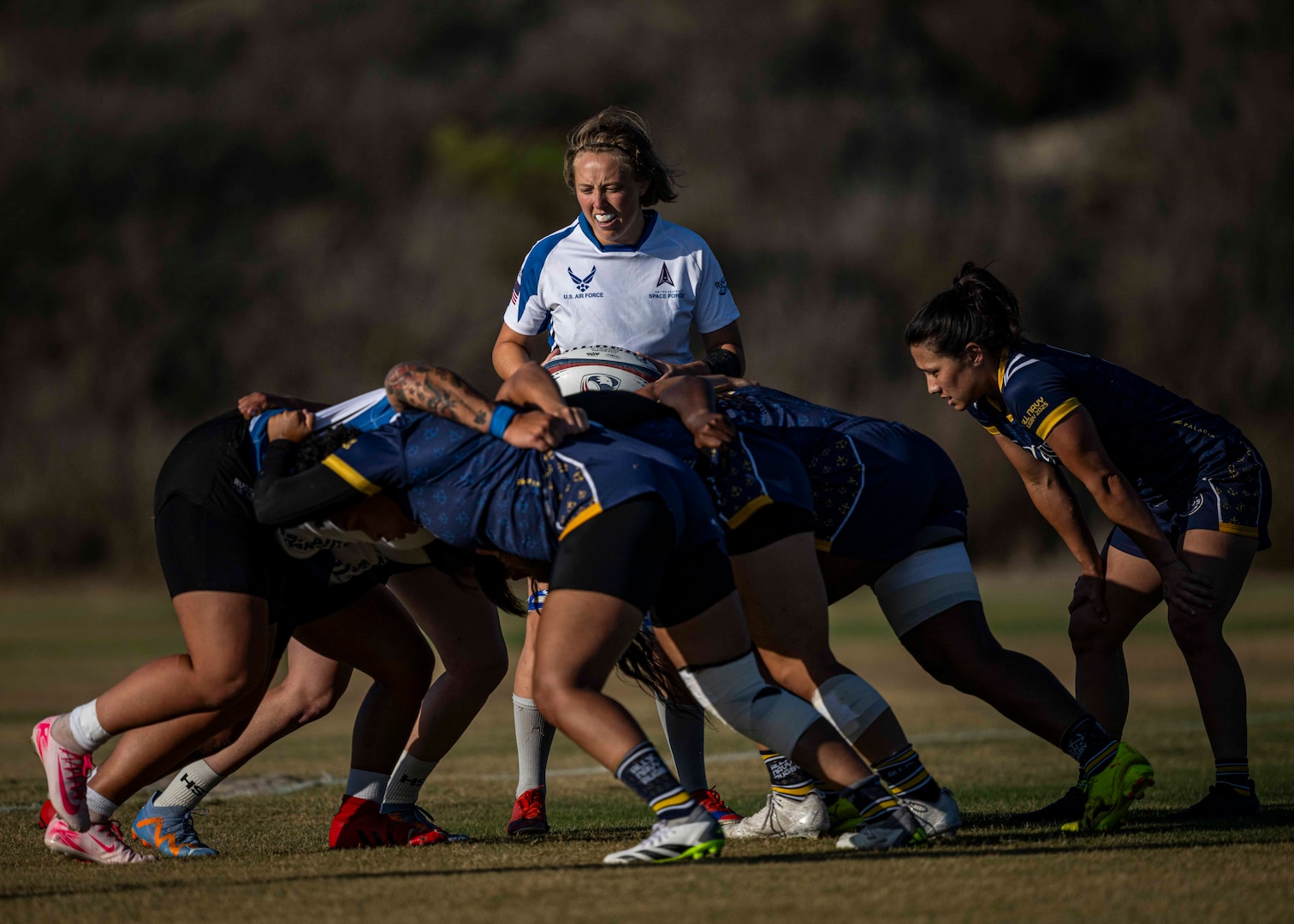 Air Force prepares the scrum against Navy during the 2025 Armed Forces Women's Rugby Championship held at the Chula Vista Elite Athletic Center in Chula Vista, Calif. (Photo by PO1 Colby Mothershead - Released)