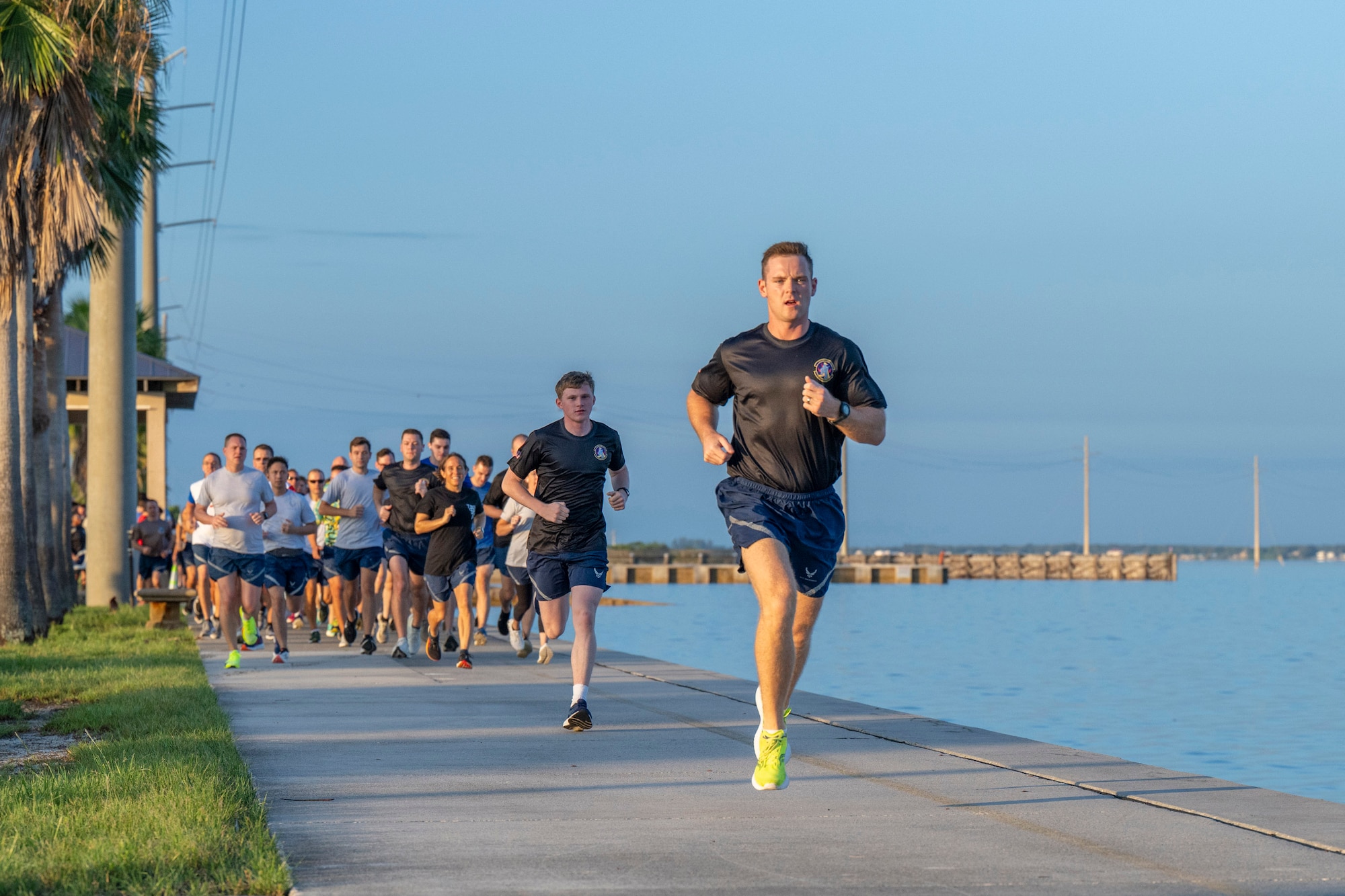 Members of the Air Force Technical Applications Center hit the ground running along the Indian River at Patrick Space Force Base, Fla., during the center’s 5K Warrior Run Aug. 28, 2025.    (U.S. Air Force photo by Matthew S. Jurgens)