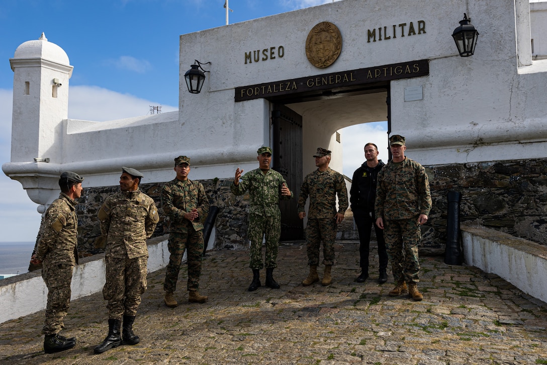 U.S. Marines and Uruguayan service members stand in front of the entrance of a Uruguayan historic site during a subject matter expert exchange in Uruguay, August 14, 2025. This subject matter expert exchange enhances the training and readiness standards for the United States and Uruguay as well as facilitating the exchange of formalized readiness standards between both countries. (U.S. Marine Corps photo by Sgt. Eduardo Delatorre)