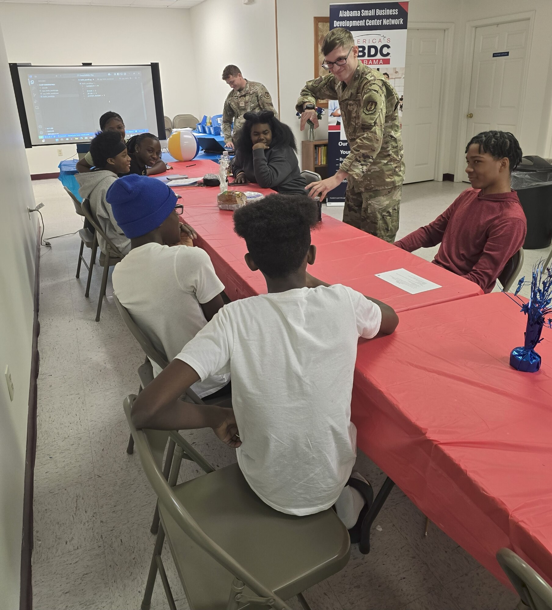 A1C Bania and Rymszewicz leading STEM workshops at Camp KARATer