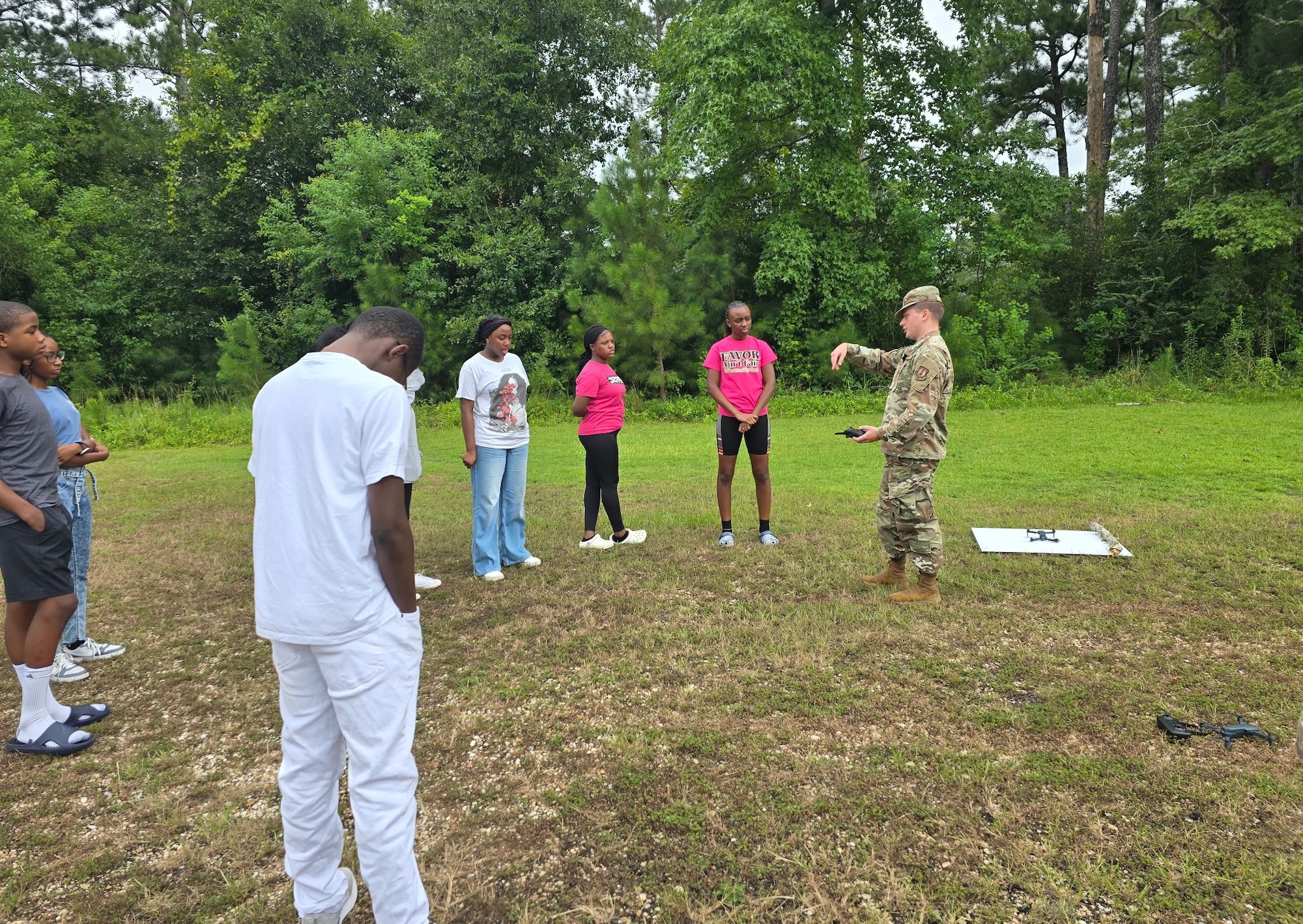 A1C Bania and Rymszewicz leading a drone workshop during Camp KARATer