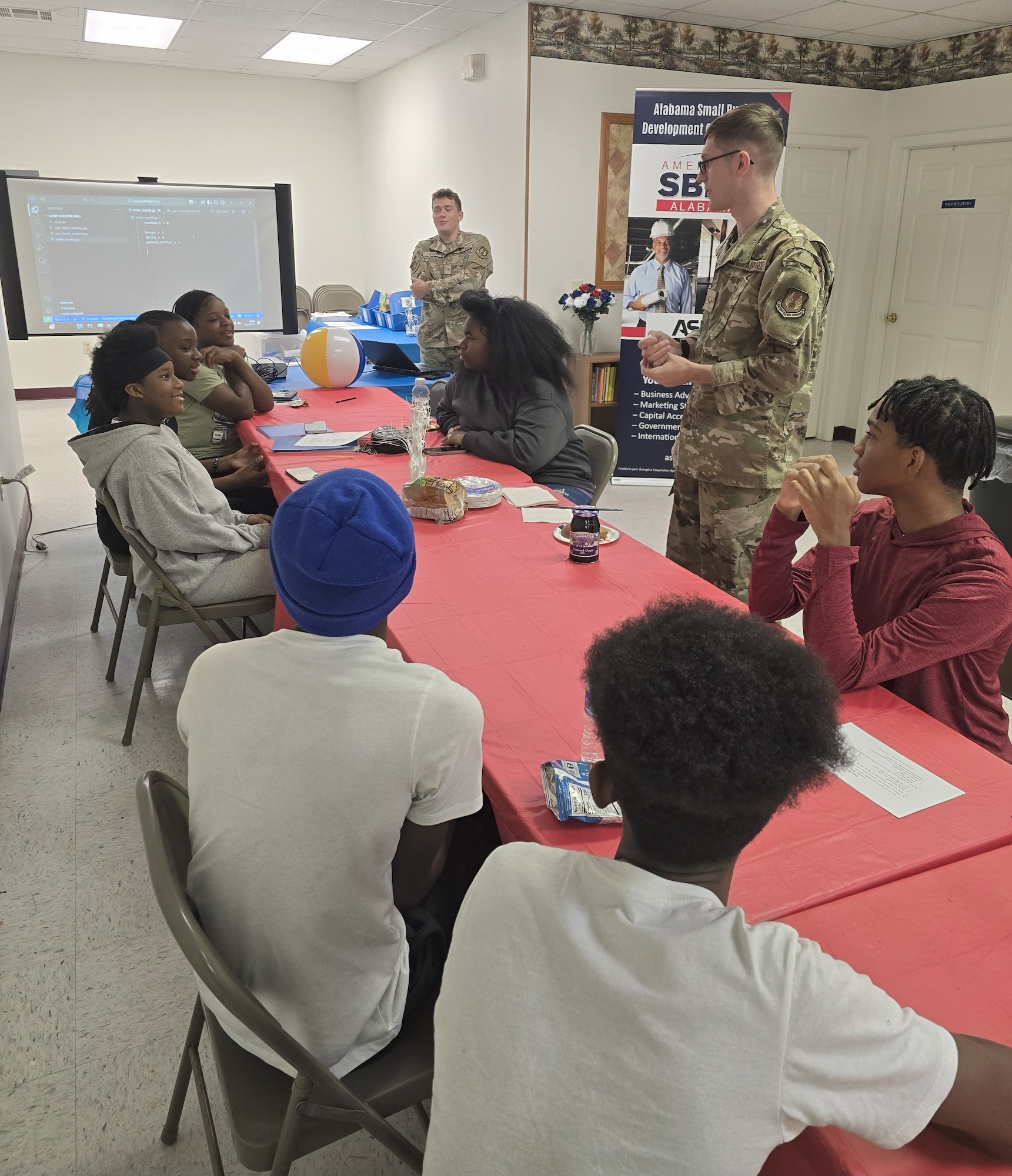 A1C Bania and Rymszewicz leading STEM workshops at Camp KARATer