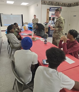 A1C Bania and Rymszewicz leading STEM workshops at Camp KARATer
