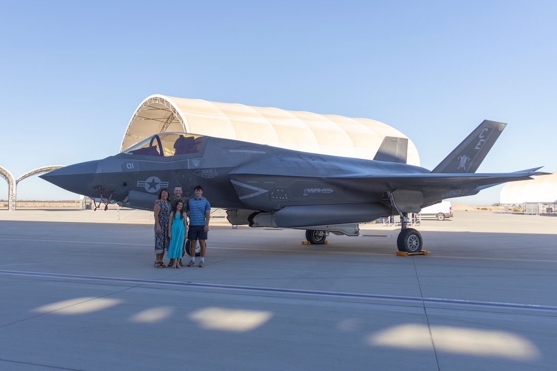U.S. Marine Corps Col. Roy J. Nicka, the outgoing commanding officer of Marine Aircraft Group 13, 3rd Marine Aircraft Wing, and family pose in front of an F-35B Lightning II assigned to Marine Fighter Attack Squadron (VMFA) 225, MAG-13, 3rd MAW, before his change of command ceremony at Marine Corps Air Station Yuma, Arizona, Aug. 29, 2025.