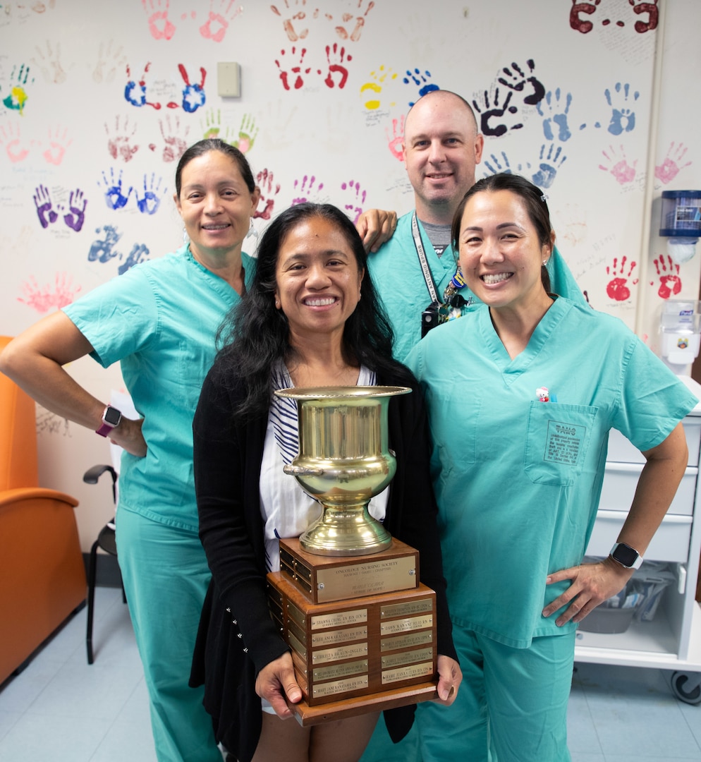 Sherilyn Long (front left), the 2026 Mana’olana Nurse of Hope Award recipient, is pictured with colleagues Abigail Troncoso, RN, Joshua Thompson, RN and Jennifer Peralta, RN, at Tripler Army Medical Center. Long was recognized for her dedication to patient care and compassionate approach to oncology nursing by the Oncology Nursing Society Hawaii chapter. (Defense Health Agency photo by Hugh Fleming)