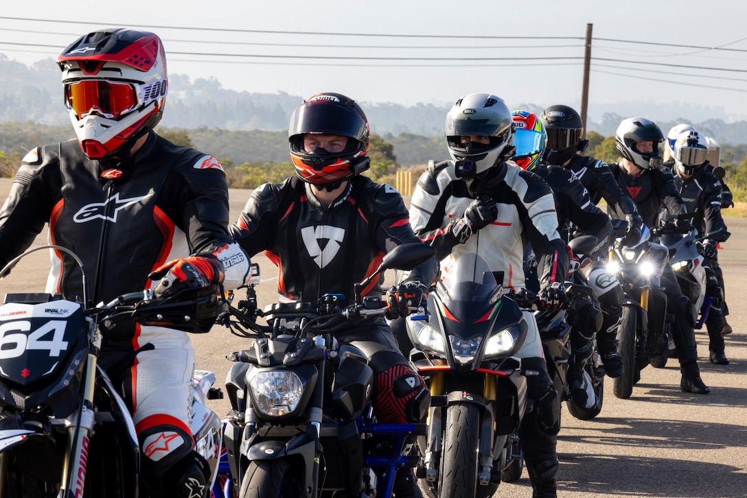 U.S. service members across southern California prepare to ride motorcycles during a level three instructive course for the California Superbike School at Marine Corps Air Station Miramar, California, June 28, 2025. The California Motorbike School gives professional coaching to improve riding skills in a controlled environment. To better develop safe and reactive riding, the motorcycle course was hosted on the installation to teach service members and dependents safe and reactive riding. (U.S. Marine Corps photo by Lance Cpl. Jackson Rush)