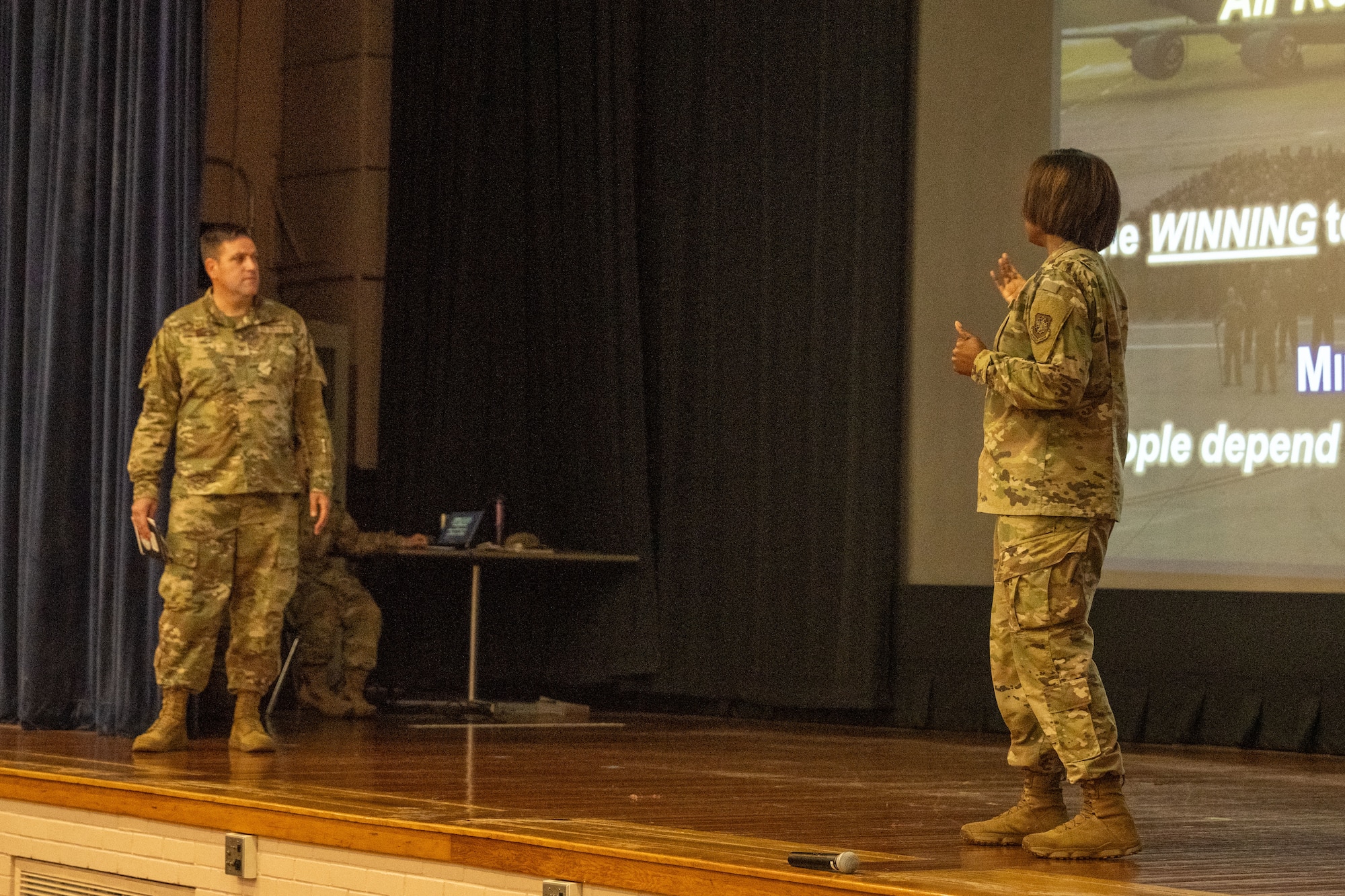 From left, Col. Joe Wall, 22nd Air Refueling Wing commander, and Chief Master Sgt. Markiesha Crawford, 22nd ARW command chief, host an all-call at McConnell Air Force Base, Kansas, Sept. 4, 2025. During his first all-call, Wall went over his priorities and goals for the duration of his command at McConnell. (U.S. Air Force photo by Senior Airman Felicia Przydzial)