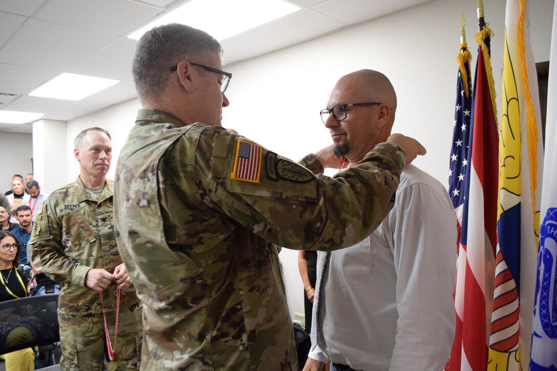 Brig. Gen. Miller presents the distinguish U.S. ARMY ENGINEER ASSOCIATION BRONZE ORDER OF THE DE FLEURY MEDAL