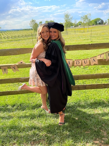 Two sisters pose for a photo