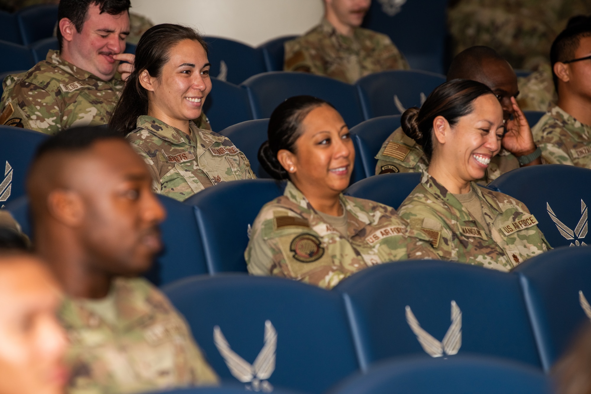 Airmen laughing in the audience
