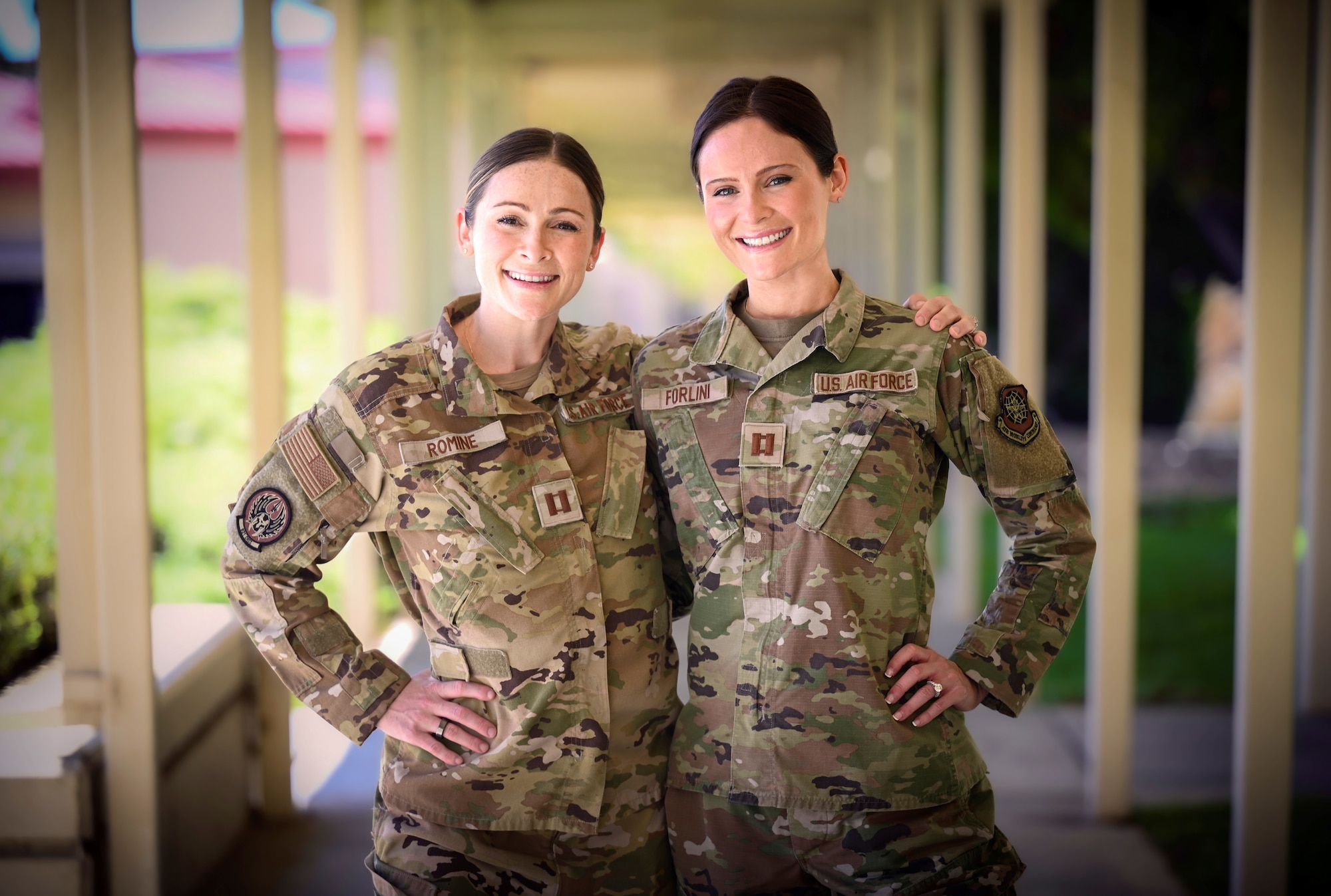 Two twin sisters pose for a photo at Travis Air Force Base