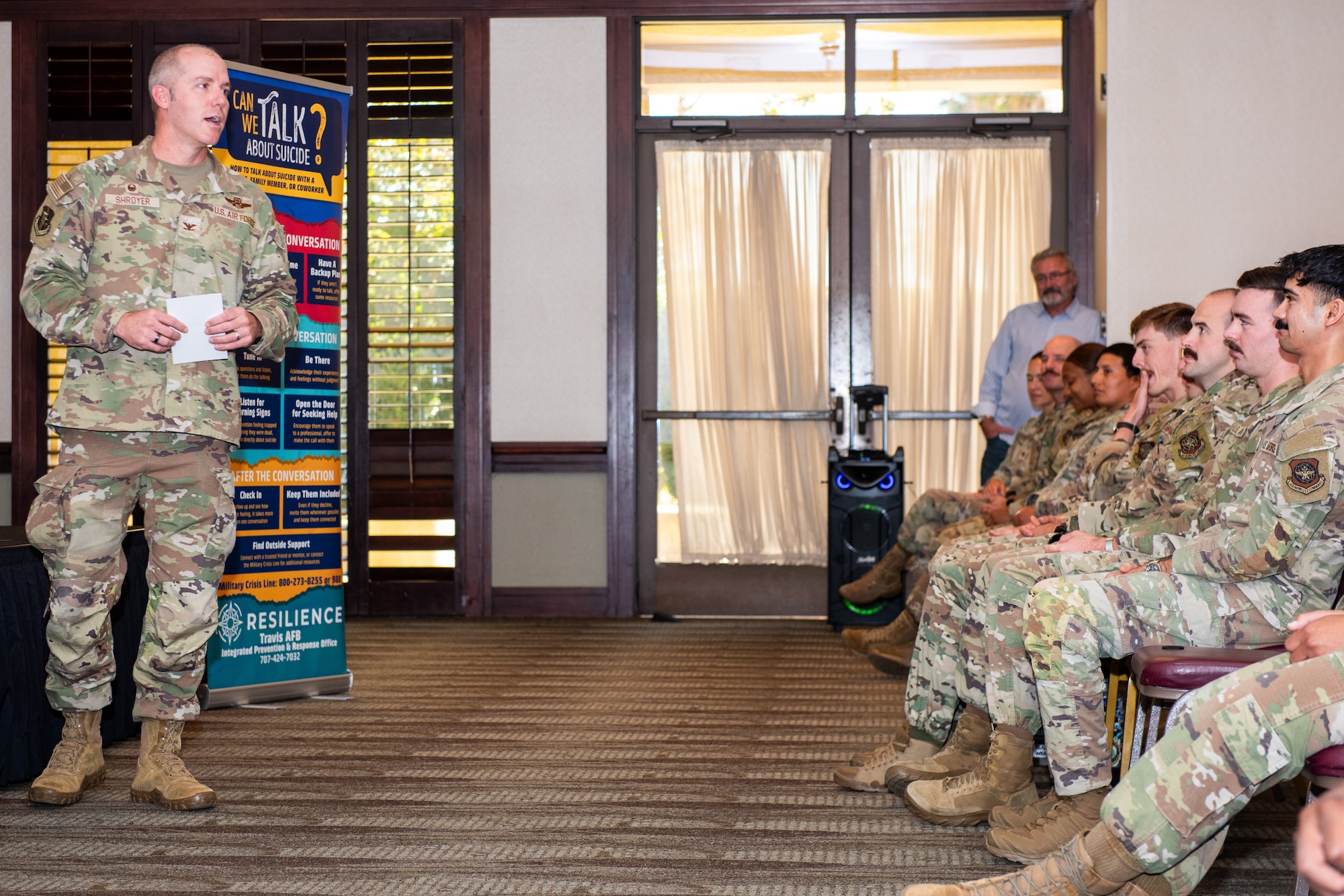 Commander speaks during comedy session