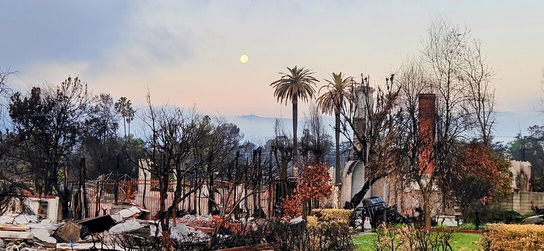 Sunrise over the devastated landscape of Altadena, Calif., March 15, 2025. USACE-Albuquerque District employee Keith Winemiller took the photo while deployed in support of the USACE Southern California wildfires recovery mission after wildfires burned parts of Los Angeles in January 2025.