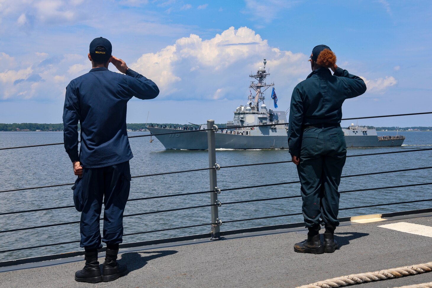 (July 18, 2025) Operations Specialist 2nd Class Aaron Diaz (left) and Boatswain’s Mate 3rd Class Sanaa Cooks (right) assigned to the Arleigh Burke-class guided-missile destroyer USS Bulkeley (DDG 84) pass honors and salute the USS Thomas Hudner (DDG 116) during a sea-and-anchor detail. USS Bulkeley is on a scheduled deployment in the U.S. 6th Fleet area of operations to support the warfighting effectiveness, lethality and readiness of U.S. Naval Forces Europe-Africa, and defend U.S., Allied and partner interests in the region. (U.S. Navy photo by Mass Communication Specialist 2nd Class Jonathan Nye)