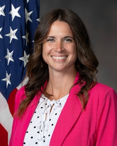 Photo of woman in pink jacket.
