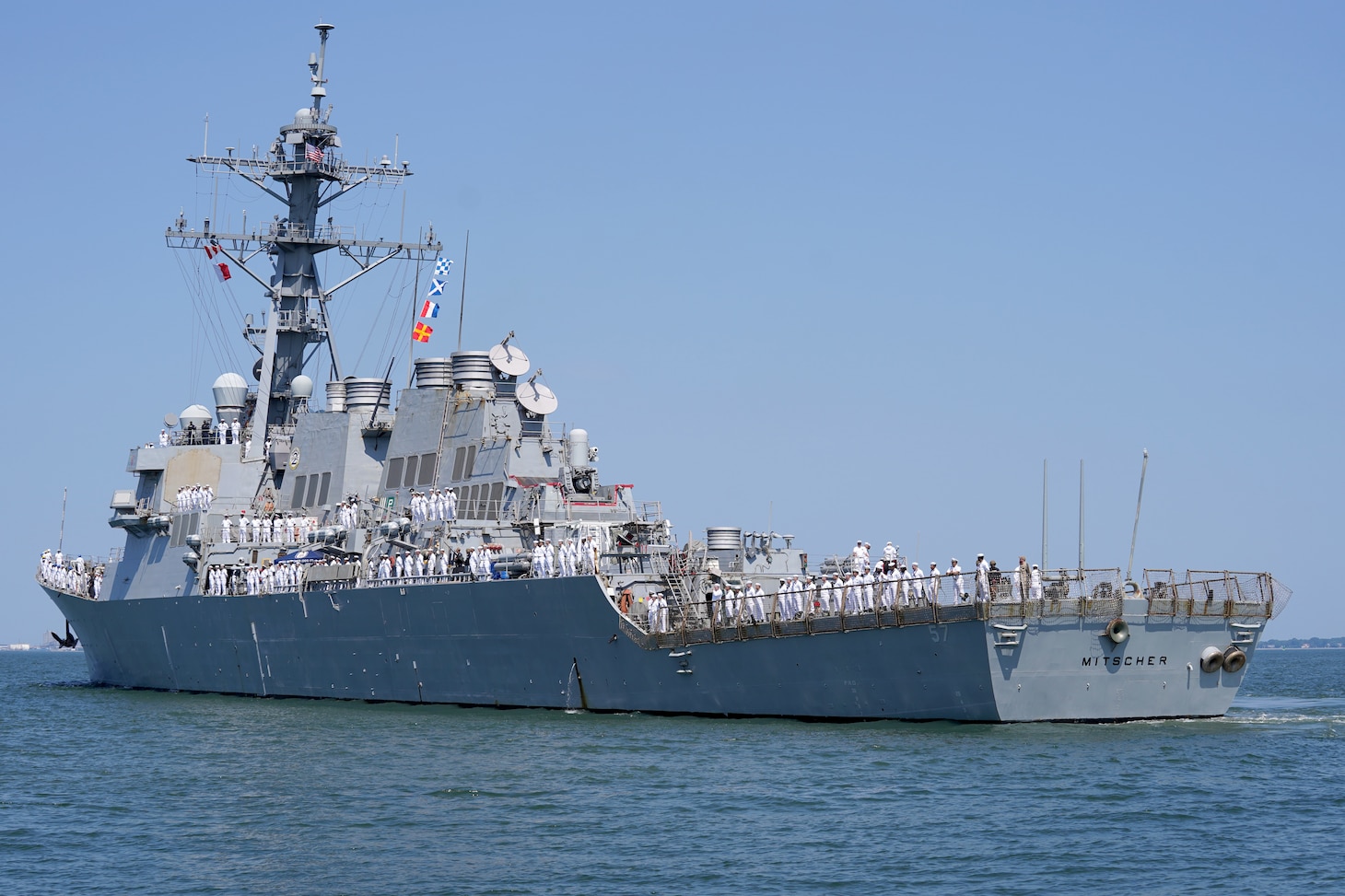The Arleigh Burke-class guided-missile destroyer USS Mitscher (DDG 57) departs Naval Station Norfolk, July 25, for a regularly scheduled deployment as part of the Gerald R. Ford Carrier Strike Group (GRFCSG). The GRFCSG is deployed to the U.S. European Command area of responsibility to underpin American security and economic prosperity, deter adversaries, and project power on a global scale through sustained operations at sea. (U.S. Navy photo by Mass Communication Specialist 1st Class Clay M. Whaley)