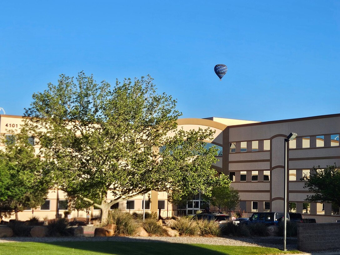 A hot air balloon floats over the USACE-Albuquerque District Office the morning of April 24, 2025.