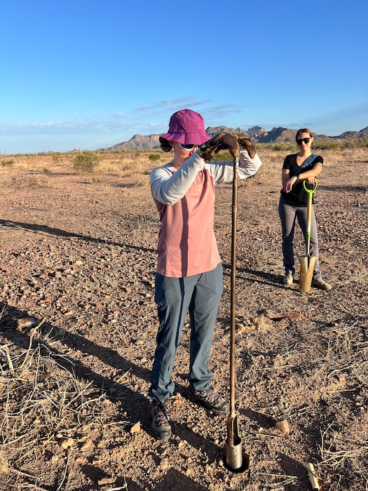 Corey Bowen, geotechnical engineer in the district’s Geotechnical Engineering Section, samples soil with a hand auger at the BLM Equestrian Facility, Goldfield, Arizona, project in Apache Junction, Ariz., July 3, 2025. Photo by Chris Carroll.