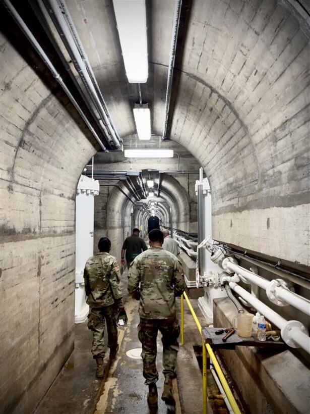 Jonathan Hicks, Conchas Lake natural resource specialist, gives a tour of Conchas Dam, Aug. 4, 2025, to two Army cadets sponsored by the Albuquerque District this summer.