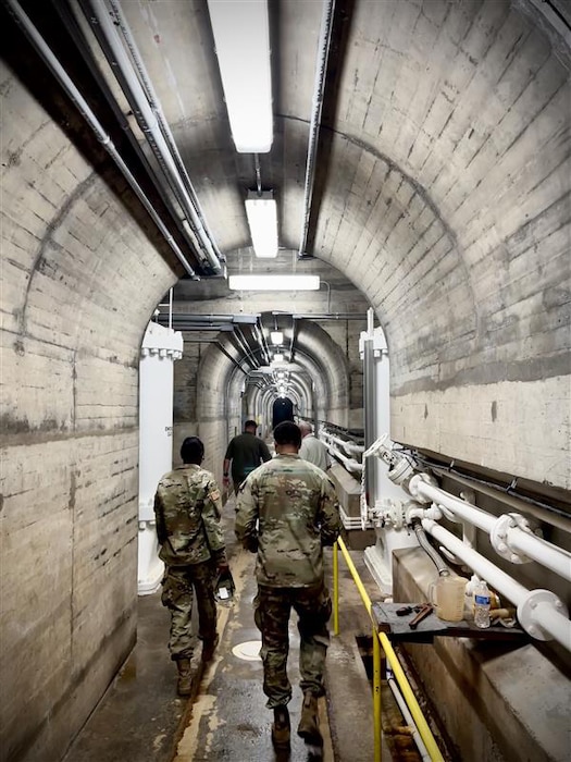 Jonathan Hicks, Conchas Lake natural resource specialist, gives a tour of Conchas Dam, Aug. 4, 2025, to two Army cadets sponsored by the Albuquerque District this summer. Photo by Capt. Garrett Falk.