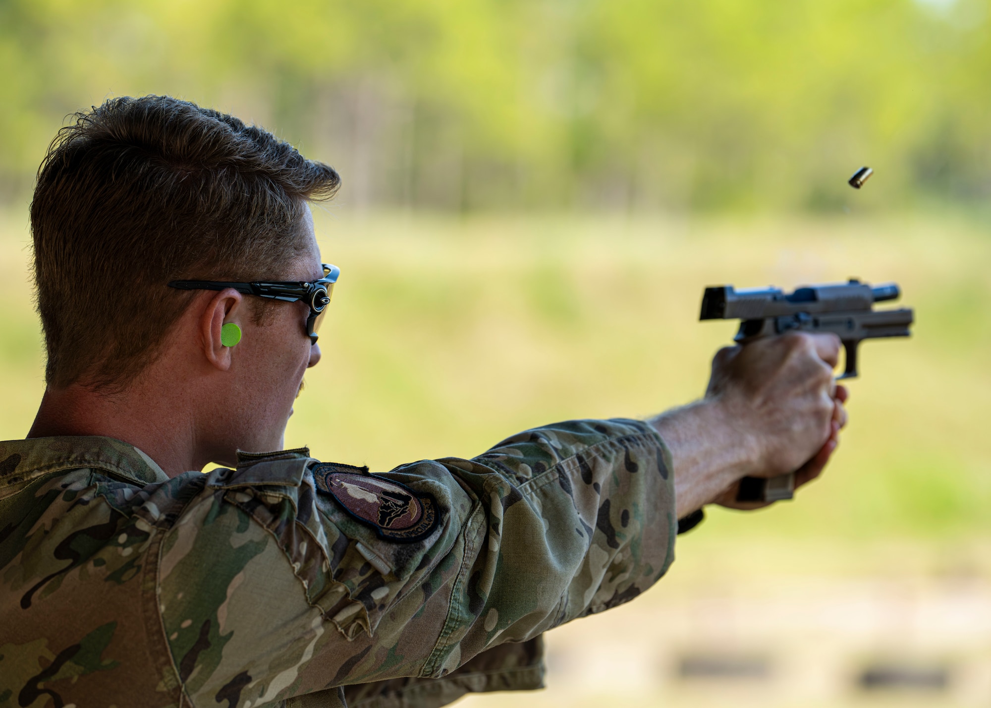 A U.S. Airman assigned to the 1st Special Operations Wing competes in a combat arms training and maintenance qualification test at Hurlburt Field, Florida