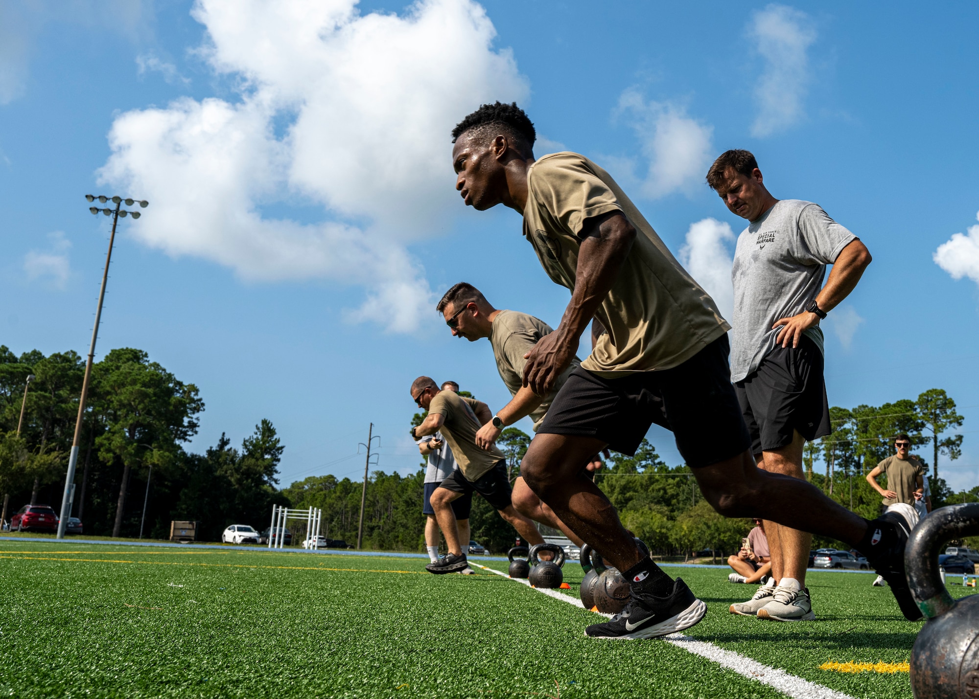 U.S. Airmen assigned to the 1st Special Operations Wing begin a shuttle run at Hurlburt Field, Florida