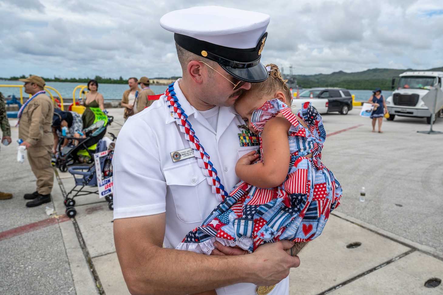 NAVAL BASE GUAM (August 31, 2025) Master Chief Information Systems Technician (Communications) Chris Ries, chief of the boat of the Los Angeles-class fast-attack submarine USS Springfield (SSN 761) shares a hug with his child, August 31, 2025. Springfield returns to its homeport at Naval Base Guam after completing a routine deployment in the Indo-Pacific. Assigned to Commander, Submarine Squadron 15, based at Polaris Point, Naval Base Guam, Springfield is one of five forward-deployed fast-attack submarines. Renowned for their unparalleled speed, endurance, stealth, and mobility, fast-attack submarines are the backbone of the Navy’s submarine force. Regarded as apex predators of the sea, Guam’s fast-attack submarines serve at the tip of the spear, helping to reaffirm the submarine force's forward-deployed presence in support of a free and open Indo-Pacific. (U.S. Navy photo by Lt. James Caliva)