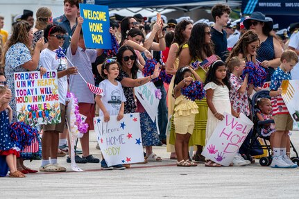 NAVAL BASE GUAM (August 31, 2025) Families of Sailors wait as the Los Angeles-class fast-attack submarine USS Springfield (SSN 761) moors at Naval Base Guam returning to its homeport after completing a routine deployment in the Indo-Pacific, August 31, 2025. Assigned to Commander, Submarine Squadron 15, based at Polaris Point, Naval Base Guam, Springfield is one of five forward-deployed fast-attack submarines. Renowned for their unparalleled speed, endurance, stealth, and mobility, fast-attack submarines are the backbone of the Navy’s submarine force. Regarded as apex predators of the sea, Guam’s fast-attack submarines serve at the tip of the spear, helping to reaffirm the submarine force's forward-deployed presence in support of a free and open Indo-Pacific. (U.S. Navy photo by Lt. James Caliva)