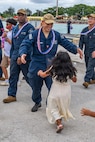 NAVAL BASE GUAM (August 31, 2025) A Sailors assigned to the Los Angeles-class fast-attack submarine USS Springfield (SSN 761) runs to greet his child, August 31, 2025. Springfield returns to its homeport at Naval Base Guam after completing a routine deployment in the Indo-Pacific. Assigned to Commander, Submarine Squadron 15, based at Polaris Point, Naval Base Guam, Springfield is one of five forward-deployed fast-attack submarines. Renowned for their unparalleled speed, endurance, stealth, and mobility, fast-attack submarines are the backbone of the Navy’s submarine force. Regarded as apex predators of the sea, Guam’s fast-attack submarines serve at the tip of the spear, helping to reaffirm the submarine force's forward-deployed presence in support of a free and open Indo-Pacific. (U.S. Navy photo by Lt. James Caliva)