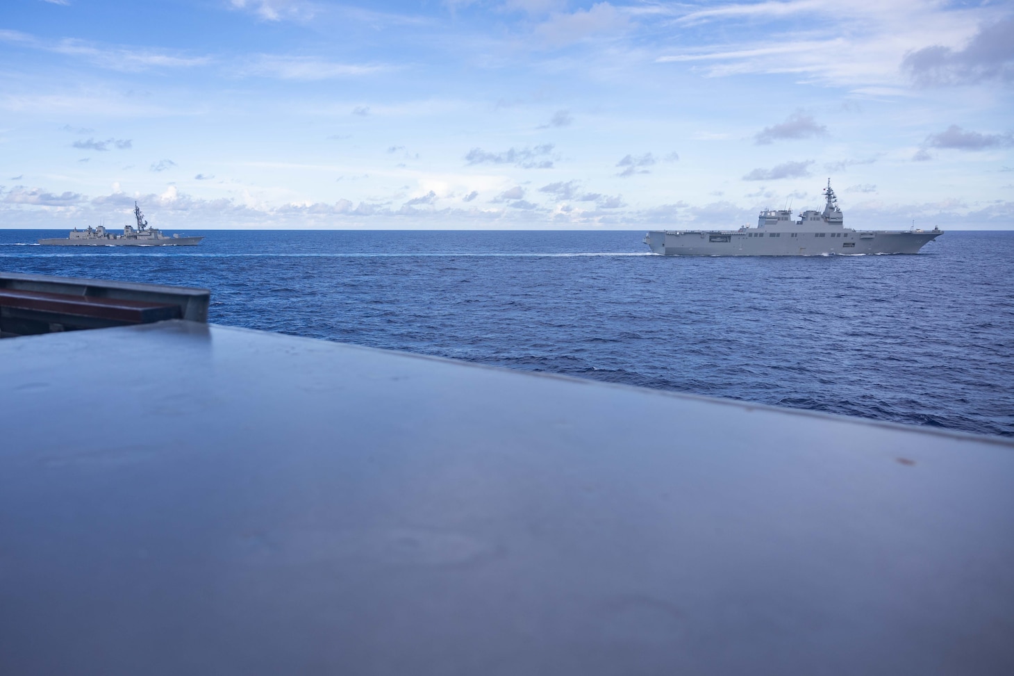 Japanese Maritime Self-Defense Force ships JS Ise (DDH 182) and JS Suzunami (DD 114) sail alongside the Arleigh Burke-class guided-missile destroyer USS Higgins (DDG 76) while conducting bilateral operations in the Philippine Sea, Sept. 5.