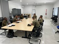 Brig. Lari Opa, deputy chief of the Papua New Guinea Defence Force, left, and U.S. Army Maj. Gen. Lance Okamura, deputy commanding general for homeland affairs at U.S. Army Pacific, discuss priorities for security cooperation during Army-to-Army Staff Talks at Murray Barracks in Port Moresby, Papua New Guinea, on Sept. 2, 2025