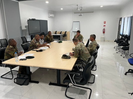 Brig. Lari Opa, deputy chief of the Papua New Guinea Defence Force, left, and U.S. Army Maj. Gen. Lance Okamura, deputy commanding general for homeland affairs at U.S. Army Pacific, discuss priorities for security cooperation during Army-to-Army Staff Talks at Murray Barracks in Port Moresby, Papua New Guinea, on Sept. 2, 2025