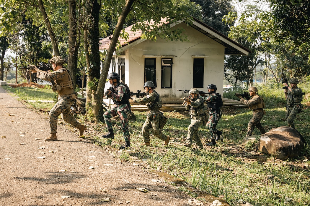 U.S. Marines with Weapons Company, 2nd Battalion, 1st Marine Regiment, Marine Rotational Force – Darwin 25.3, a Royal Dutch Marine, an Indonesian Marine, and Japan Ground Self-Defense Force soldier run across the street during close quarters battle drills during Super Garuda Shield 25 in Jakarta, Indonesia, Aug. 27, 2025.