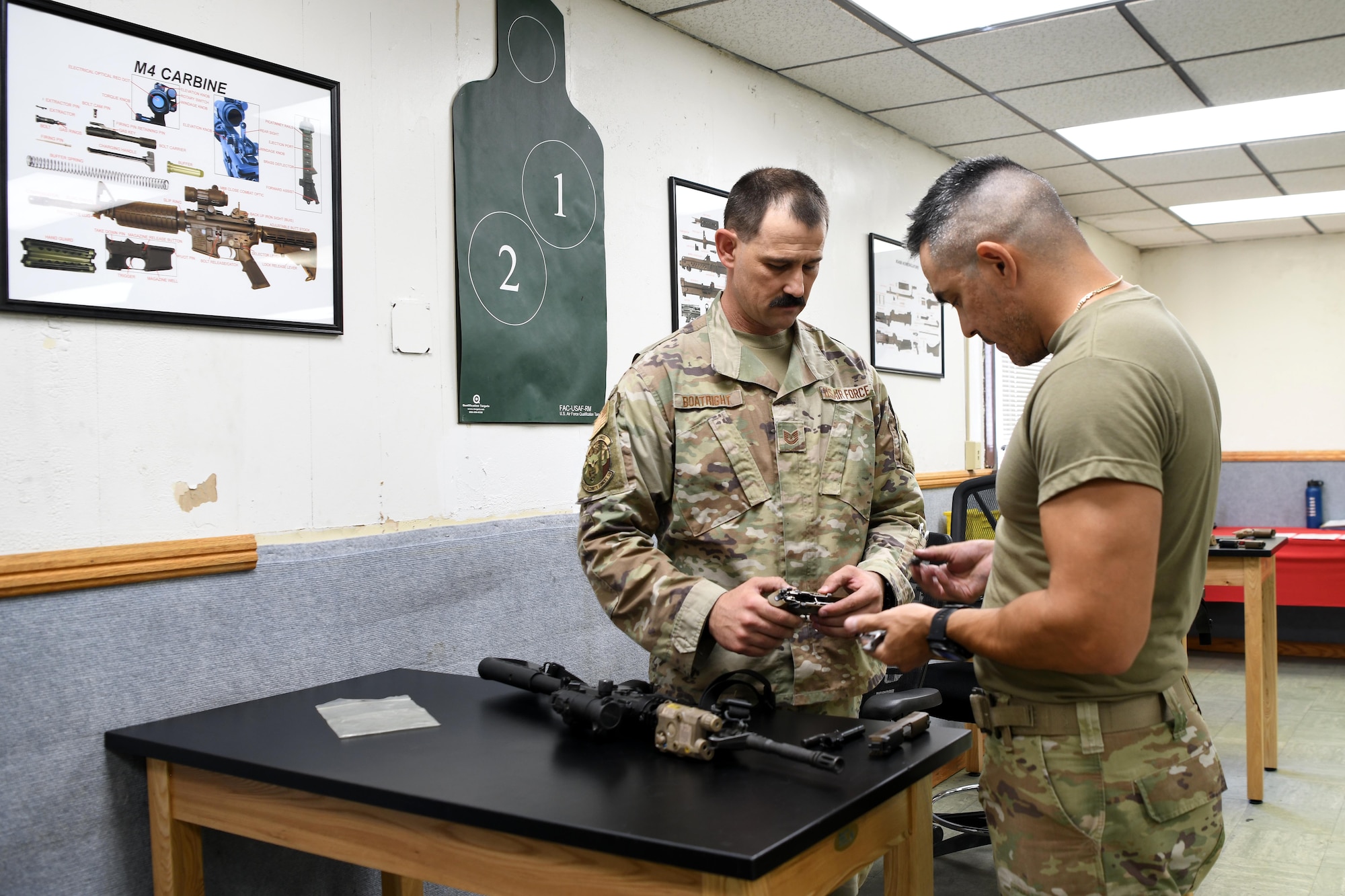 LUKE AIR FORCE BASE, Ariz. – Tech. Sgt. Steven Boatright, 944th Security Forces Squadron combat arms training and maintenance instructor, prepares weapons for training with Master Sgt. Jeffrey Seastrand, 944 SFS CATM section chief, at Luke AFB, Ariz., Aug. 8, 2025. His supervisor describes him as resilient and dependable, someone who keeps the mission moving while mentoring others in the shop. (U.S. Air Force photo by Tech. Sgt. Tricia Topasna)