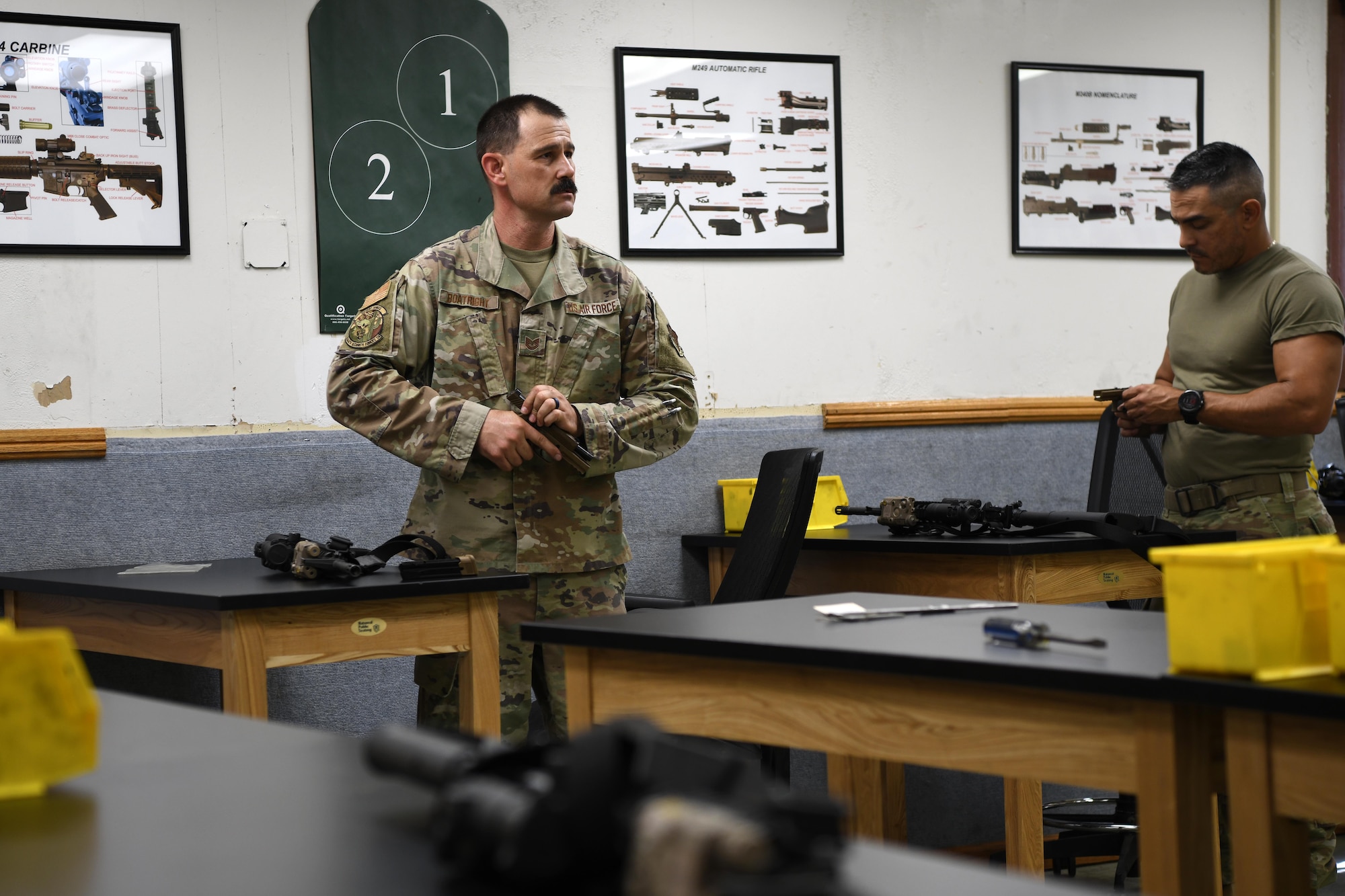 LUKE AIR FORCE BASE, Ariz. – Tech. Sgt. Steven Boatright, 944th Security Forces Squadron combat arms training and maintenance instructor, prepares weapons for training with Master Sgt. Jeffrey Seastrand, 944 SFS CATM section chief, at Luke AFB, Ariz., Aug. 8, 2025. The 944th CATM shop plays a vital role in keeping Airmen ready to deploy worldwide. (U.S. Air Force photo by Tech. Sgt. Tricia Topasna)