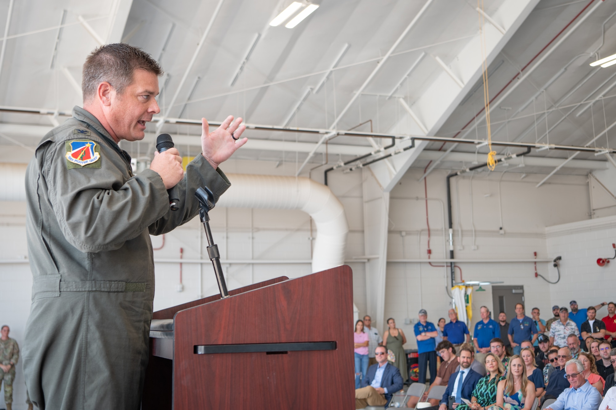 Col. Aaron “Nacho” Weedman, 924th Fighter Group commander, addresses Airmen, families, and alumni during the group’s inactivation ceremony Sept. 6, 2025, at Davis-Monthan Air Force Base, Ariz. Weedman emphasized the unit’s resilience and the legacy left by its people. (U.S. Air Force photo by Tech. Sgt. Tyler J. Bolken)