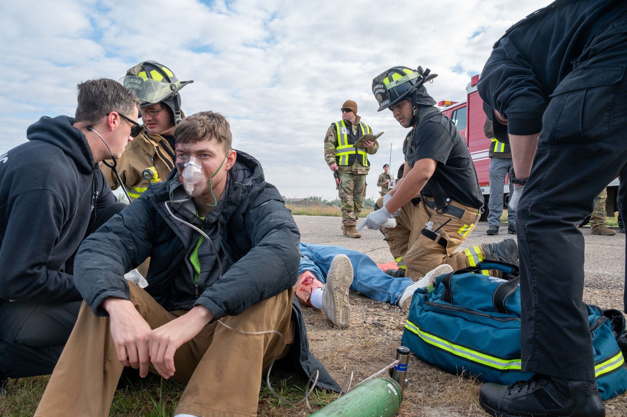 First responders provide medical care to simulated causalities during a Warbird Week exercise at Minot Air Force Base, North Dakota, Sept. 6, 2025. Warbird Week is a series of training events designed to ensure Airmen can effectively respond to real-world emergencies.