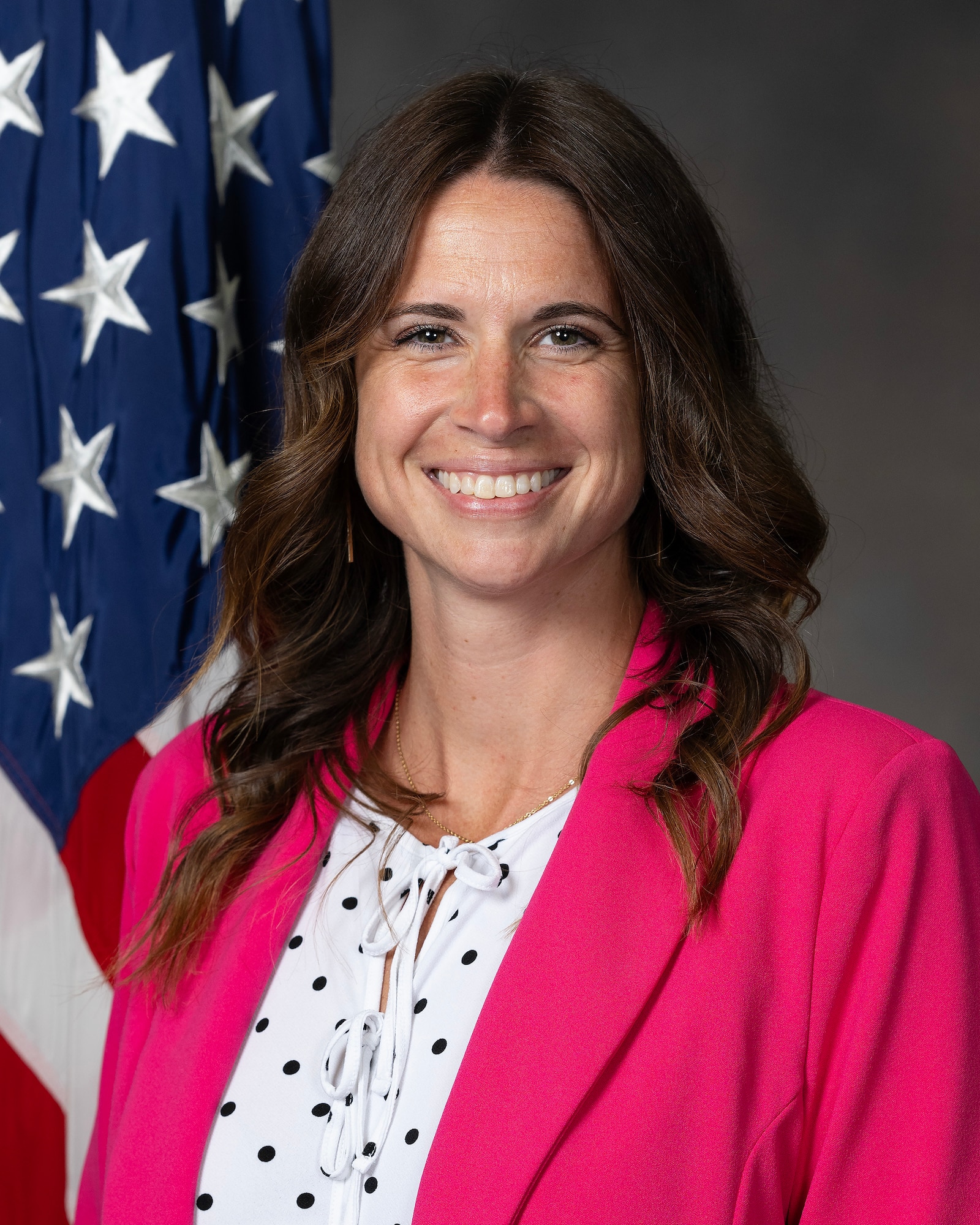 Photo of woman in pink jacket.