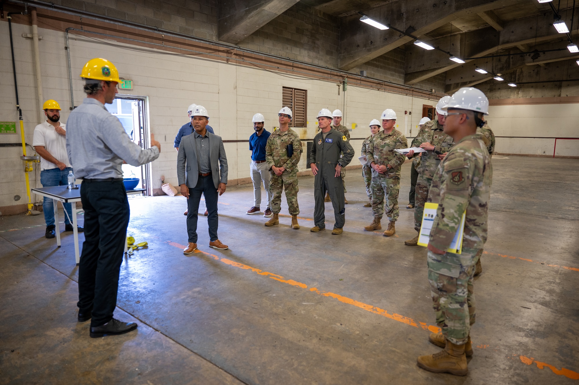 people gather around during a base tour