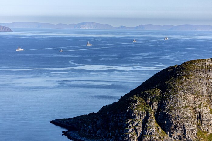 The Royal Norwegian Navy Fridtjof Nansen-class frigate HNoMS Thor Heyerdahl (F-314), left, Royal Norwegian Navy Skjold-class fast patrol boat HNoMS Steil (P-963), second from left, Arleigh Burke-class guided-missile destroyers USS Bainbridge (DDG 96), center, and USS Mahan (DDG 72), second from right, and Royal Norwegian Navy replenishment oiler HNoMS Maud (A-530) transit the Soroysundet off the northern coast of Norway above the Arctic Circle, Sep. 7, 2025.