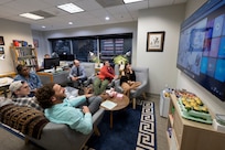 U.S. Naval Research Laboratory (NRL) scientists watch as the NRL Autonomous Planning In-space Assembly Reinforcement-learning free-flYer (APIARY) team successfully conducts the first reinforcement learning (RL) control test on free-flyer robots in space from NRL headquarters in Washington, D.C., May 27, 2025. (U.S. Navy photo by Sarah Peterson)