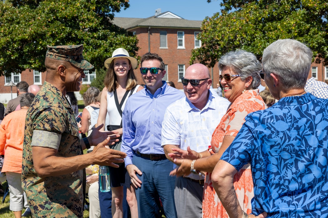 U.S. Marine Corps Lt. Gen. Calvert L. Worth Jr., commanding general, II Marine Expeditionary Force (MEF), thanks the family of Hope Fiorvanti, II Marine Expeditionary Force Chief of Protocol, during her retirement ceremony at Marine Corps Base Camp Lejeune, North Carolina, Sept. 5, 2025. For more than a decade, Fiorvanti served as a special staff officer for II MEF and was the subject matter expert on the planning, coordination and synchronization required to support all special events and Distinguished Visitors to the command. (U.S. Marine Corps Photo by Cpl. Adam Scalin)