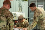U.S. Army Staff Sgt. Cody Ruth, right, and Spc. Joshua Hodges, center, assigned to the Tennessee National Guard, provide equipment to Soldiers at Joint Base Anacostia-Bolling, Sept. 4, 2025. About 2,300 National Guard members are supporting the D.C. Safe and Beautiful Task Force providing critical support to the D.C. Metropolitan Police Department in ensuring the safety of all who live, work and visit the District.