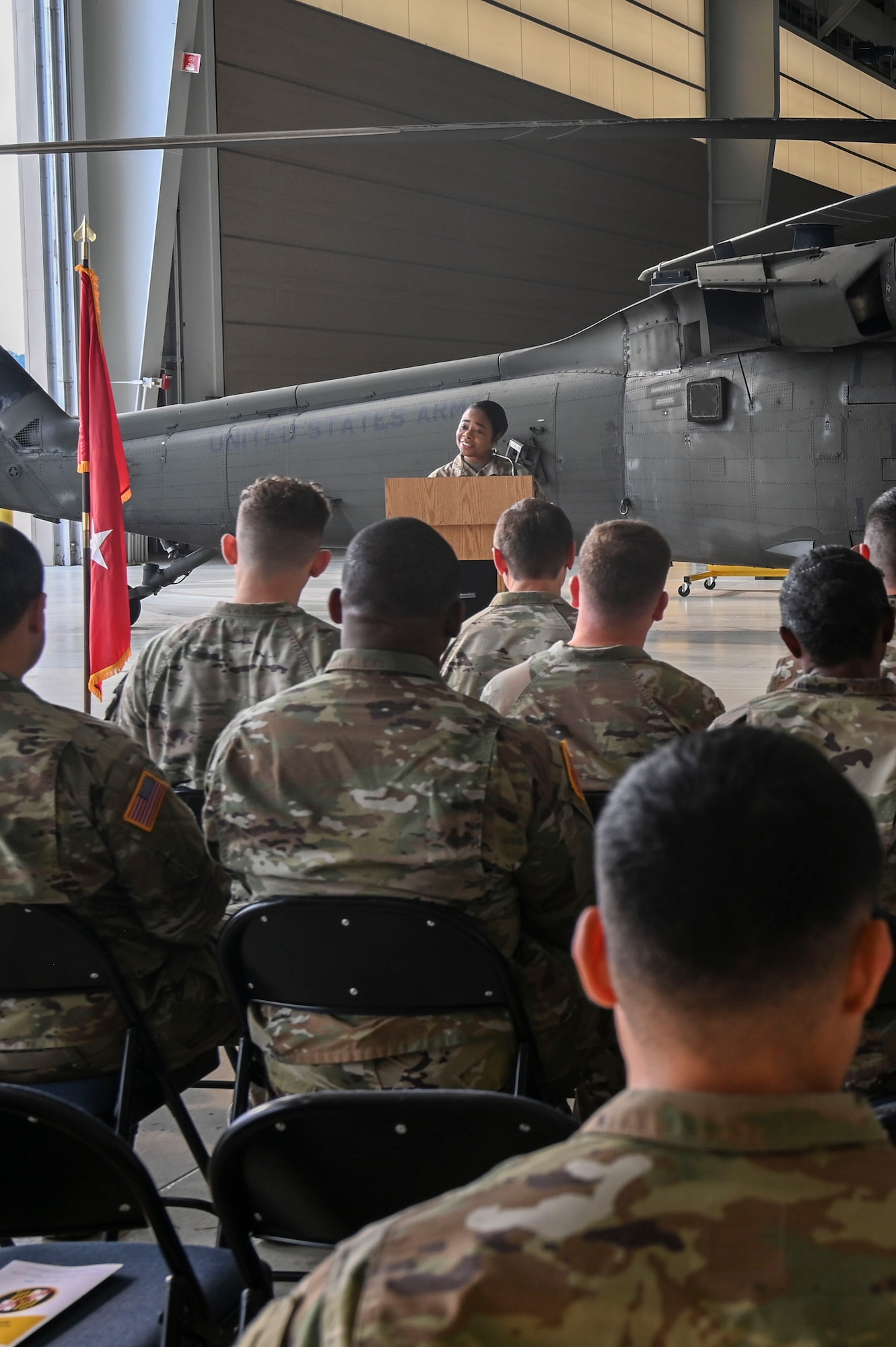Maryland National Guard legal personnel listen to remarks given by Maj. Gen. Janeen L. Birckhead, adjutant general of Maryland, at Weide Army Heliport at Aberdeen Proving Ground - South in Edgewood, Maryland, Sept. 6, 2025. The group was operating as part of an annual all-hands event for the Maryland National Guard legal offices. (U.S. Air National Guard photo by SSgt. Alexandra Huettner)