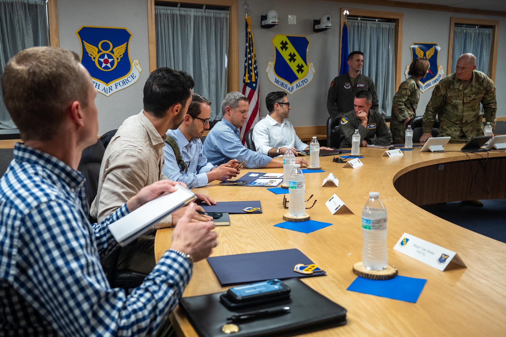 Professional Staff Members from the House China Select Committee prepare to hear a 7th Bomb Wing mission brief during a base tour at Dyess Air Force Base, Texas, Aug. 27, 2025. The brief provided insight into modernization efforts critical to maintaining Dyess AFB’s operational capabilities. (U.S. Air Force photo by Airman 1st Class Adrien Tran)