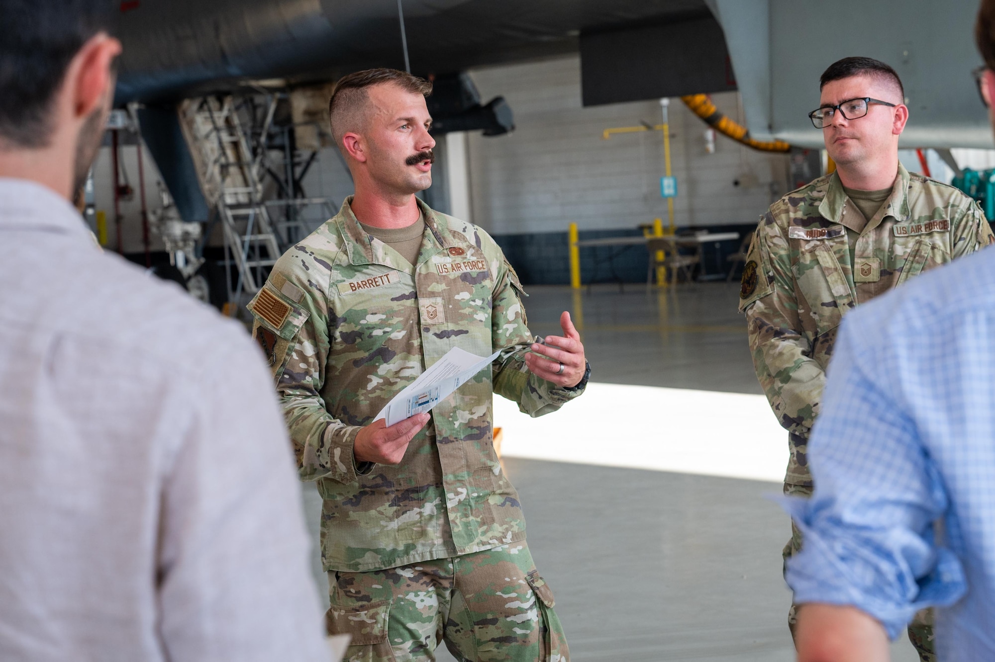 U.S. Air Force Master Sgt. Joushawa Barrett, 7th Maintenance Group maintenance tactics superintendent, briefs Professional Staff Members from the House China Select Committee during a base tour at Dyess Air Force Base, Texas, Aug. 27, 2025. During the tour, leaders emphasized Dyess AFB’s strategic mission and the importance of sustaining future readiness. (U.S. Air Force photo by Airman 1st Class Adrien Tran)